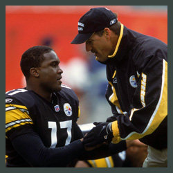 Tee speaking with coach during game